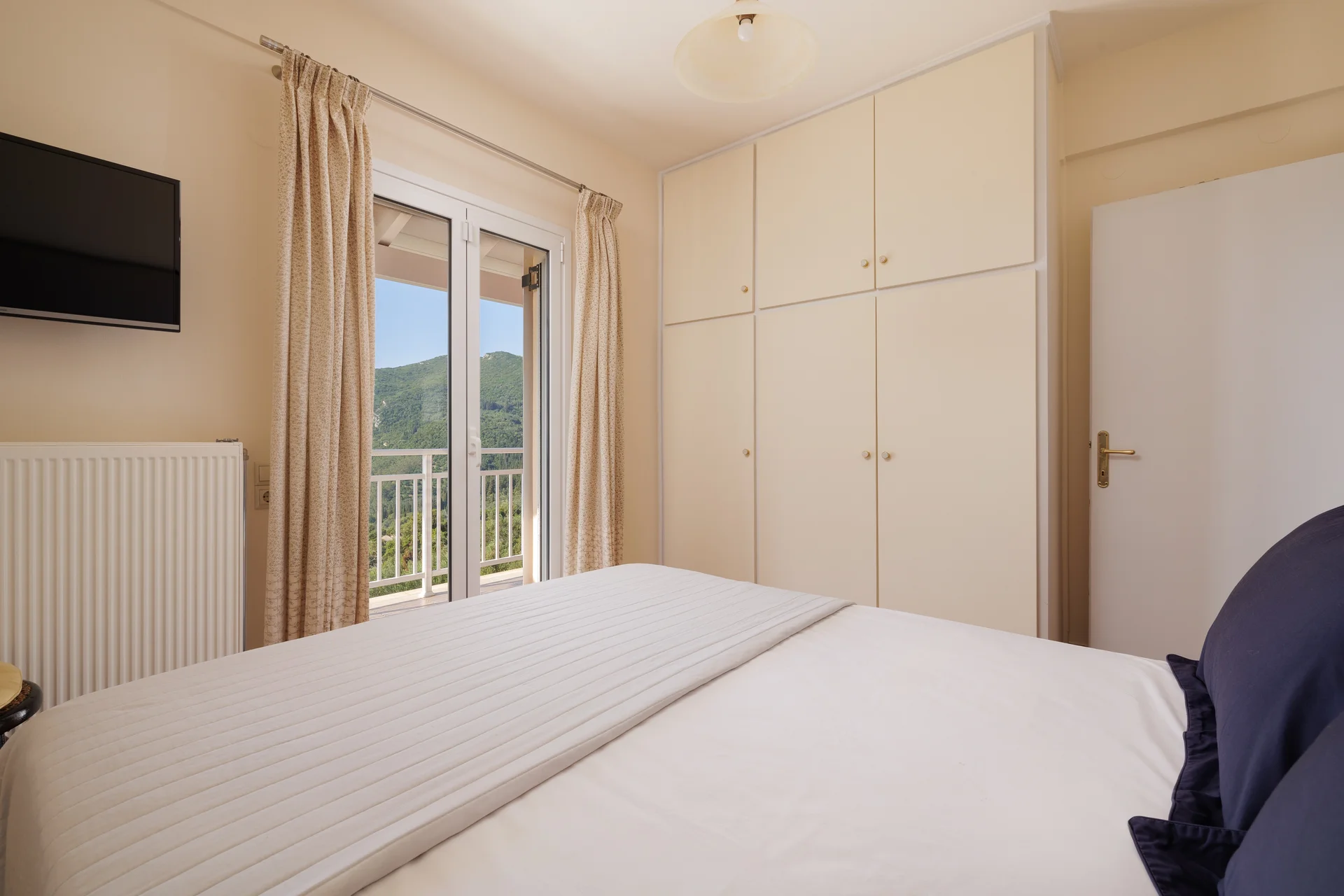 Main bedroom with double bed and A/C at Ef Zin Villa